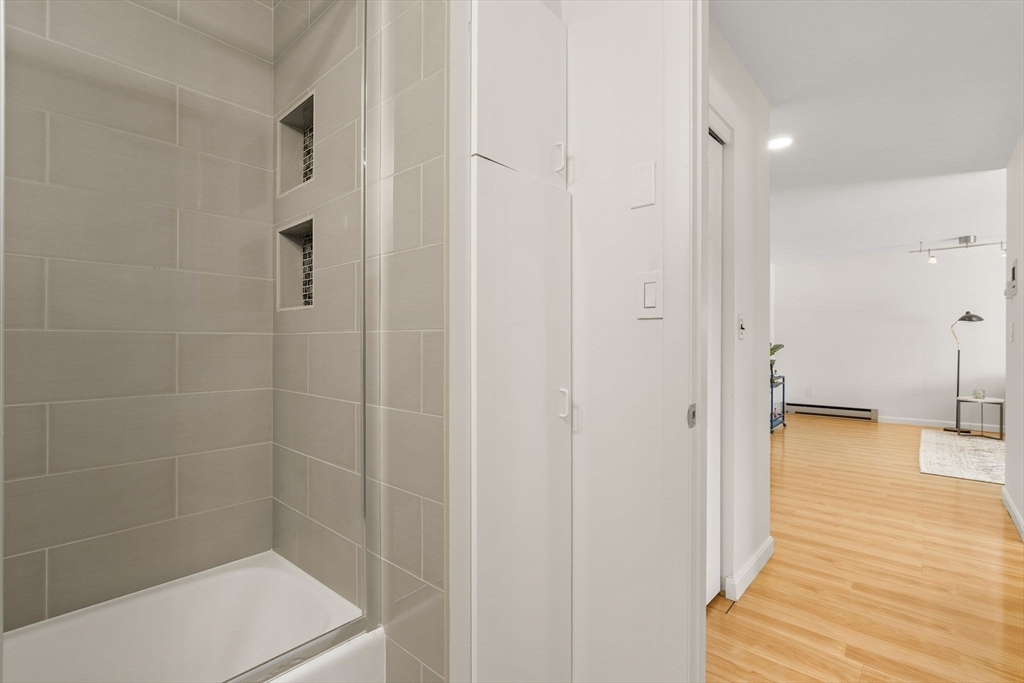 1206 Greendale Avenue, Unit 217 Needham, MA 02492 - Photo 23 of 33 a bathroom with a shower