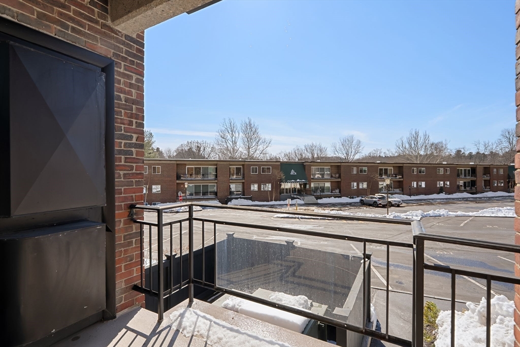 1206 Greendale Avenue, Unit 217 Needham, MA 02492 - Photo 25 of 33 a view of a balcony with city view