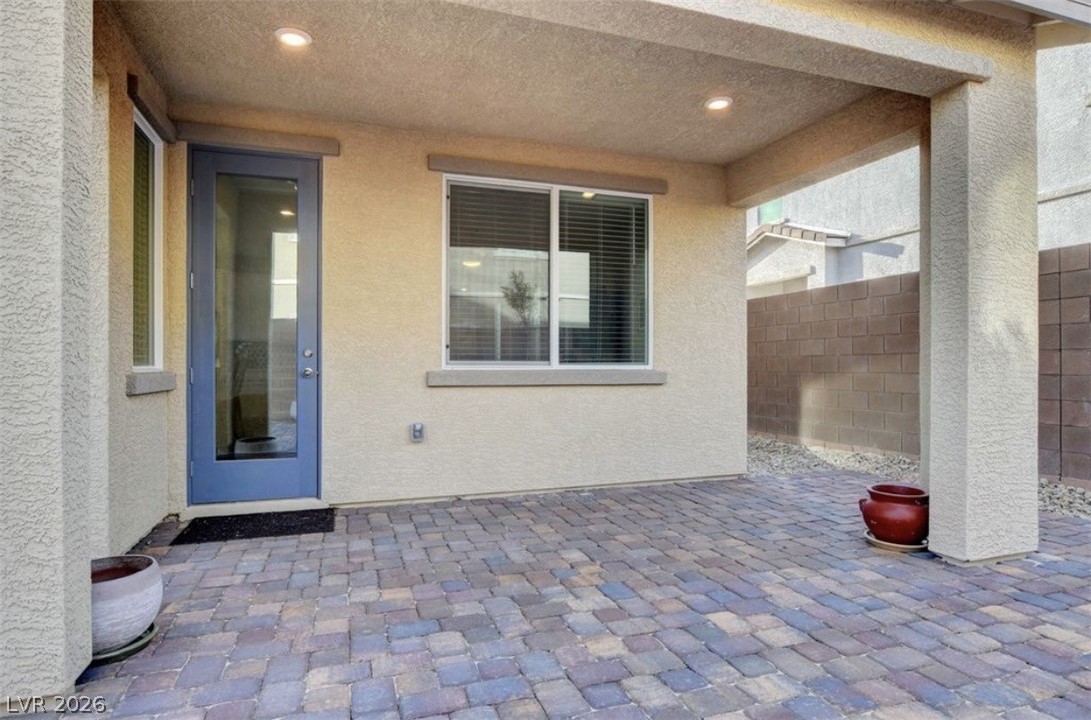 6920 Fossil Rim Street North Las Vegas, NV 89084 - Photo 7 of 9 A private outdoor space with a shaded patio, perfect for relaxing.