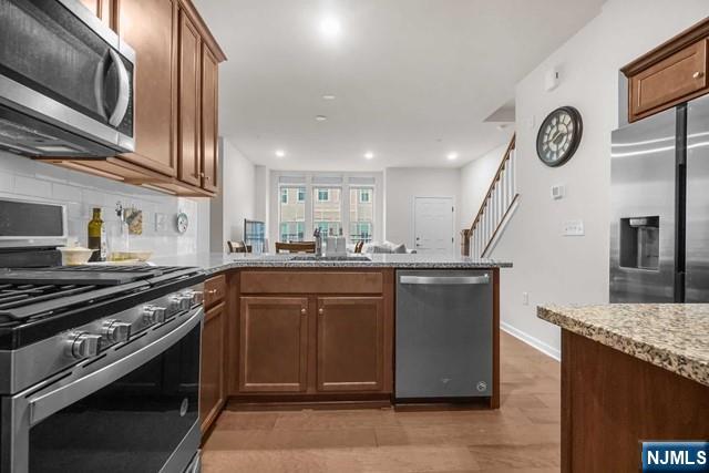 54 Arnold Drive Wood-Ridge, NJ 07075 - Photo 20 of 40 a kitchen with a sink appliances and cabinets