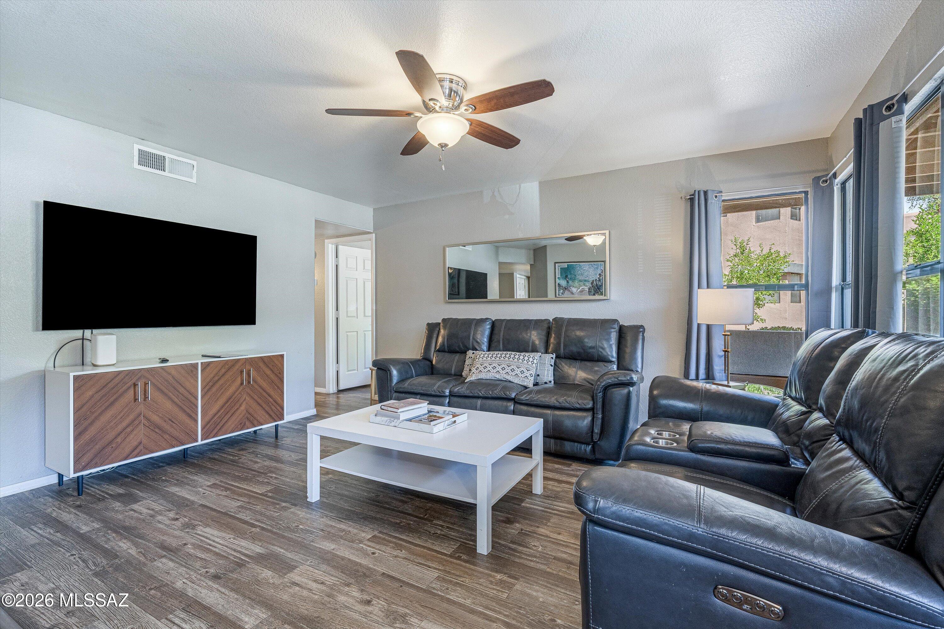 5855 North Kolb Road, Unit 8106 Tucson, AZ 85750 - Photo 3 of 34 a living room with furniture and a flat screen tv