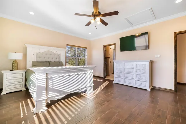 a bedroom with furniture and a window