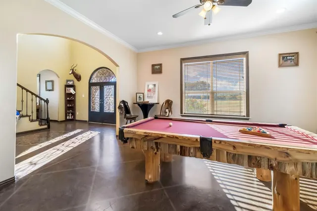 a bedroom with furniture and a window