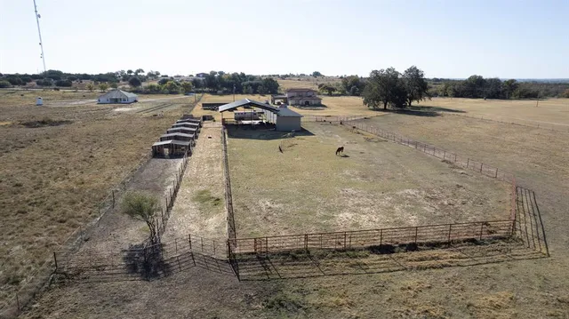 a view of a house with backyard porch and sitting area
