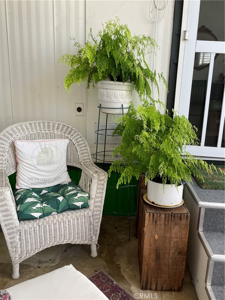 61 Hummingbird Lane Oceanside, CA 92057 - Photo 12 of 17 a wooden bench sitting in front of a door