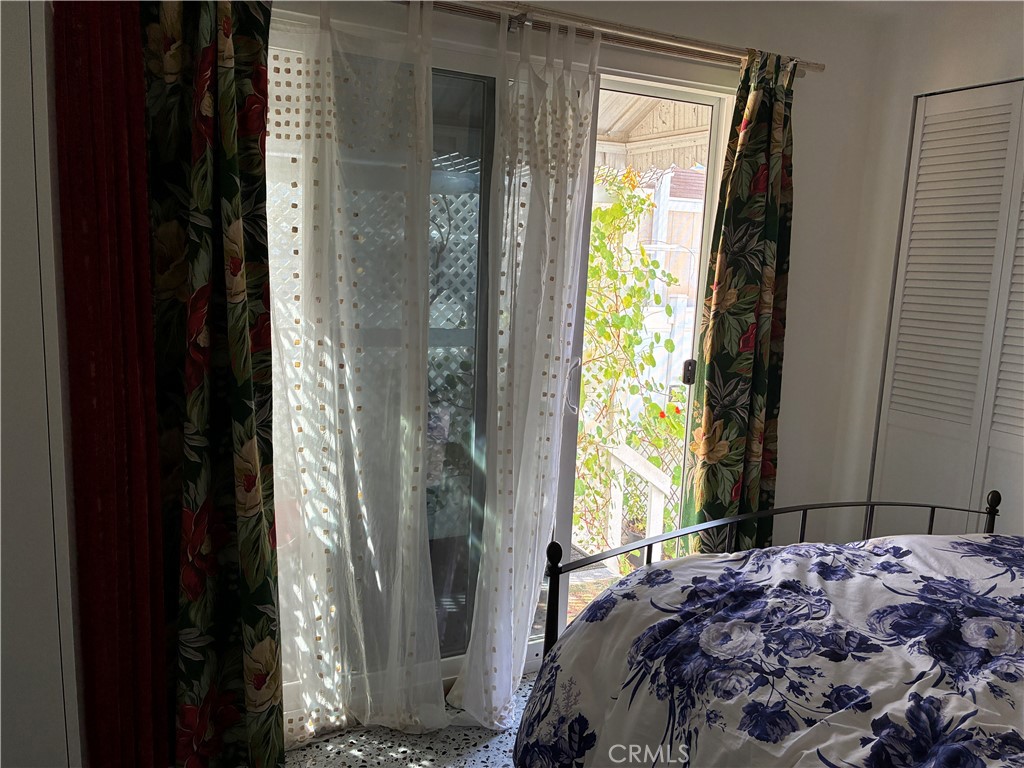 61 Hummingbird Lane Oceanside, CA 92057 - Photo 16 of 17 a bedroom with a bed and a window