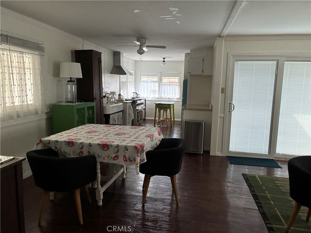 61 Hummingbird Lane Oceanside, CA 92057 - Photo 5 of 17 a view of a dining room with furniture window and wooden floor