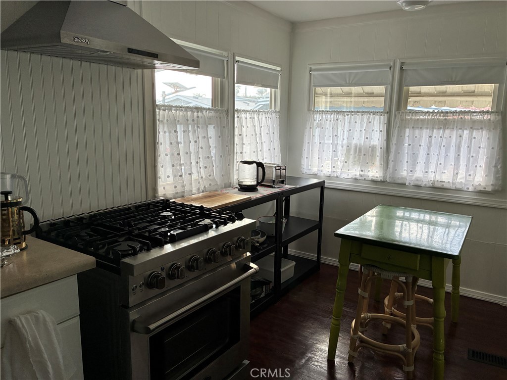 61 Hummingbird Lane Oceanside, CA 92057 - Photo 8 of 17 a kitchen with a stove and a sink