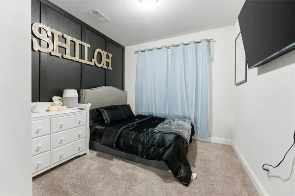 a bedroom with a bed and a cabinets