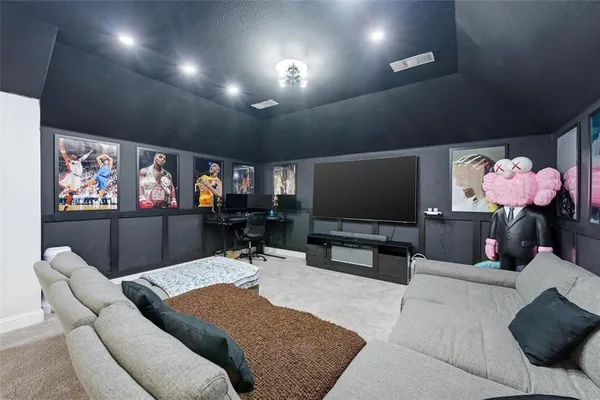 a bedroom with a large bed and a couch