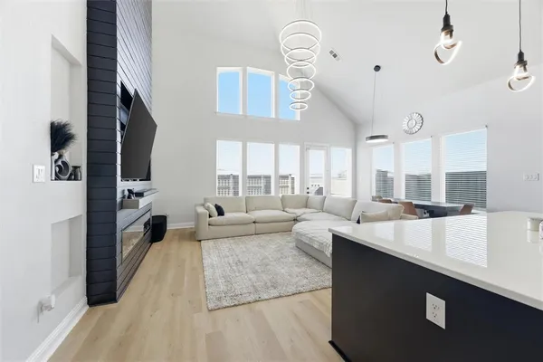 a living room with fireplace furniture and a flat screen tv