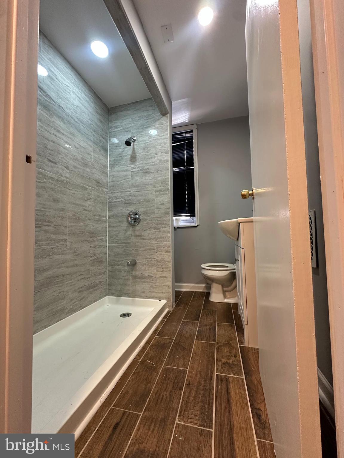 2812 Emerald Street Philadelphia, PA 19134 - Photo 22 of 25 a bathroom with a sink and a shower