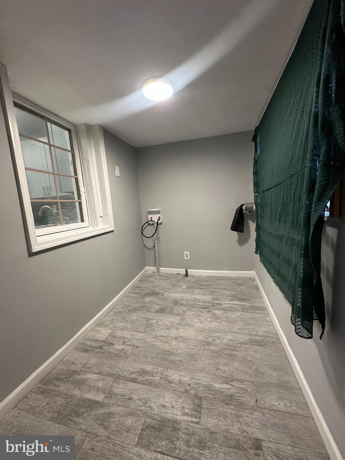 2812 Emerald Street Philadelphia, PA 19134 - Photo 9 of 25 a view of a livingroom with wooden floor and a window