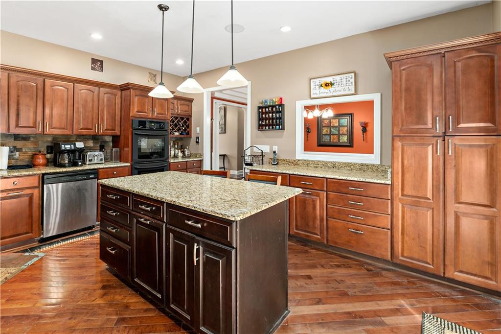 331 North Branch Road Oakdale, PA 15071 - Photo 11 of 41 a kitchen with stainless steel appliances granite countertop a sink a stove and a refrigerator