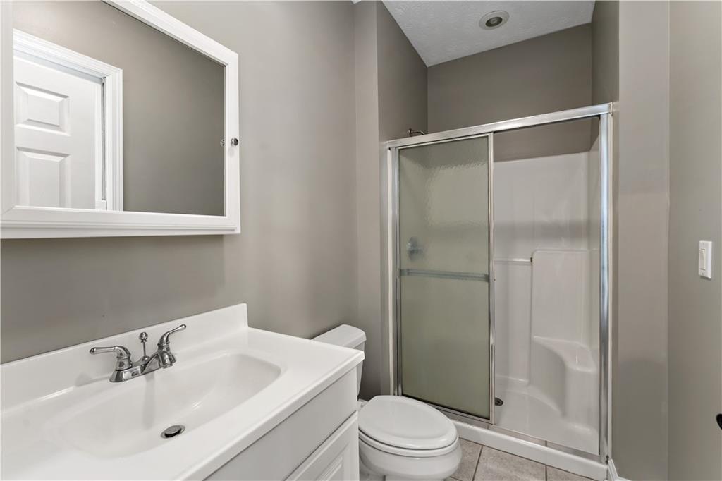 331 North Branch Road Oakdale, PA 15071 - Photo 25 of 41 a bathroom with a sink mirror shower and toilet
