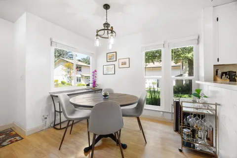 a view of a dining room with furniture window and outside view