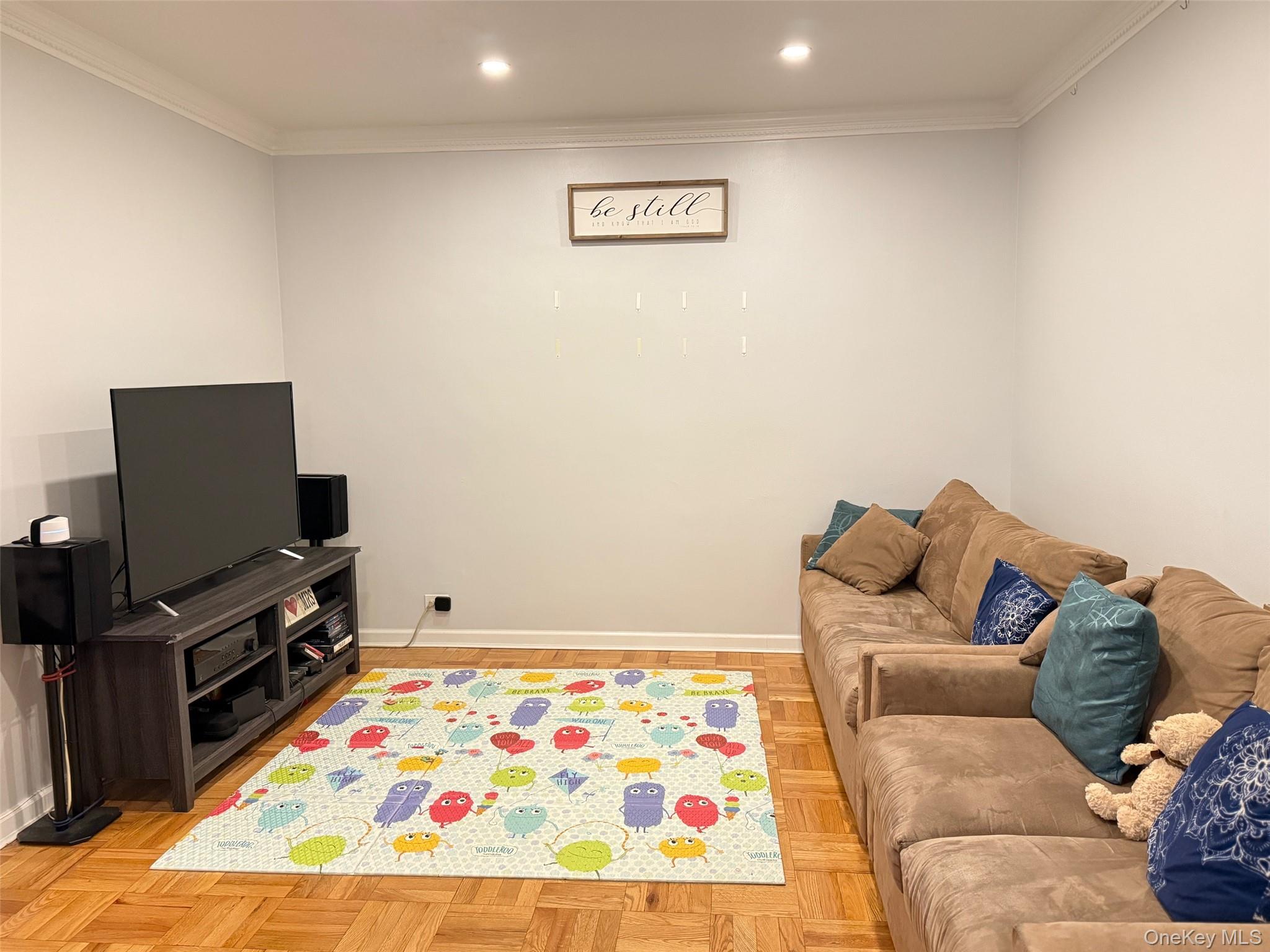 67-40 Yellowstone Boulevard, Unit 2O Queens, NY 11375 - Photo 2 of 12 a bed room with a bed and a television