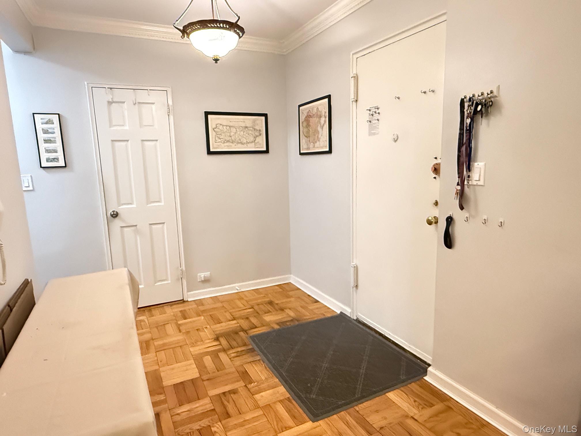 67-40 Yellowstone Boulevard, Unit 2O Queens, NY 11375 - Photo 7 of 12 a view of a bedroom with wooden floor and ceiling fan