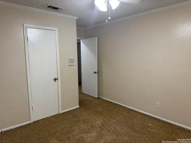 an empty room with a bathroom