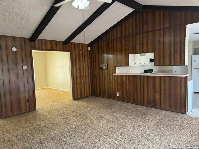 an empty room with closet and window