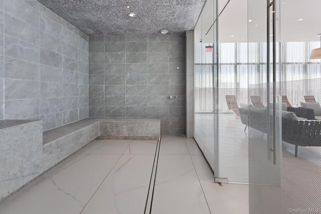 a bathroom with a bathtub and shower