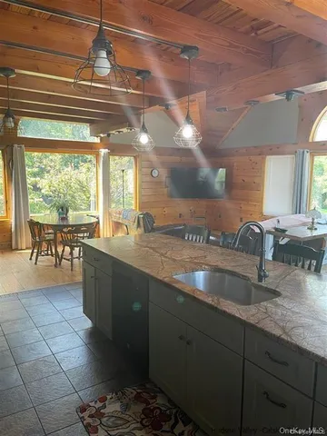 a kitchen with granite countertop a sink and a counter