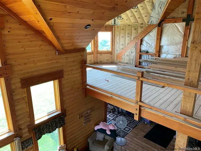 a view of balcony with wooden floor