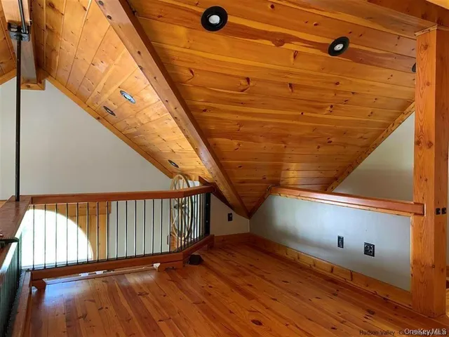 a view of balcony with a floor to ceiling window with wooden floor