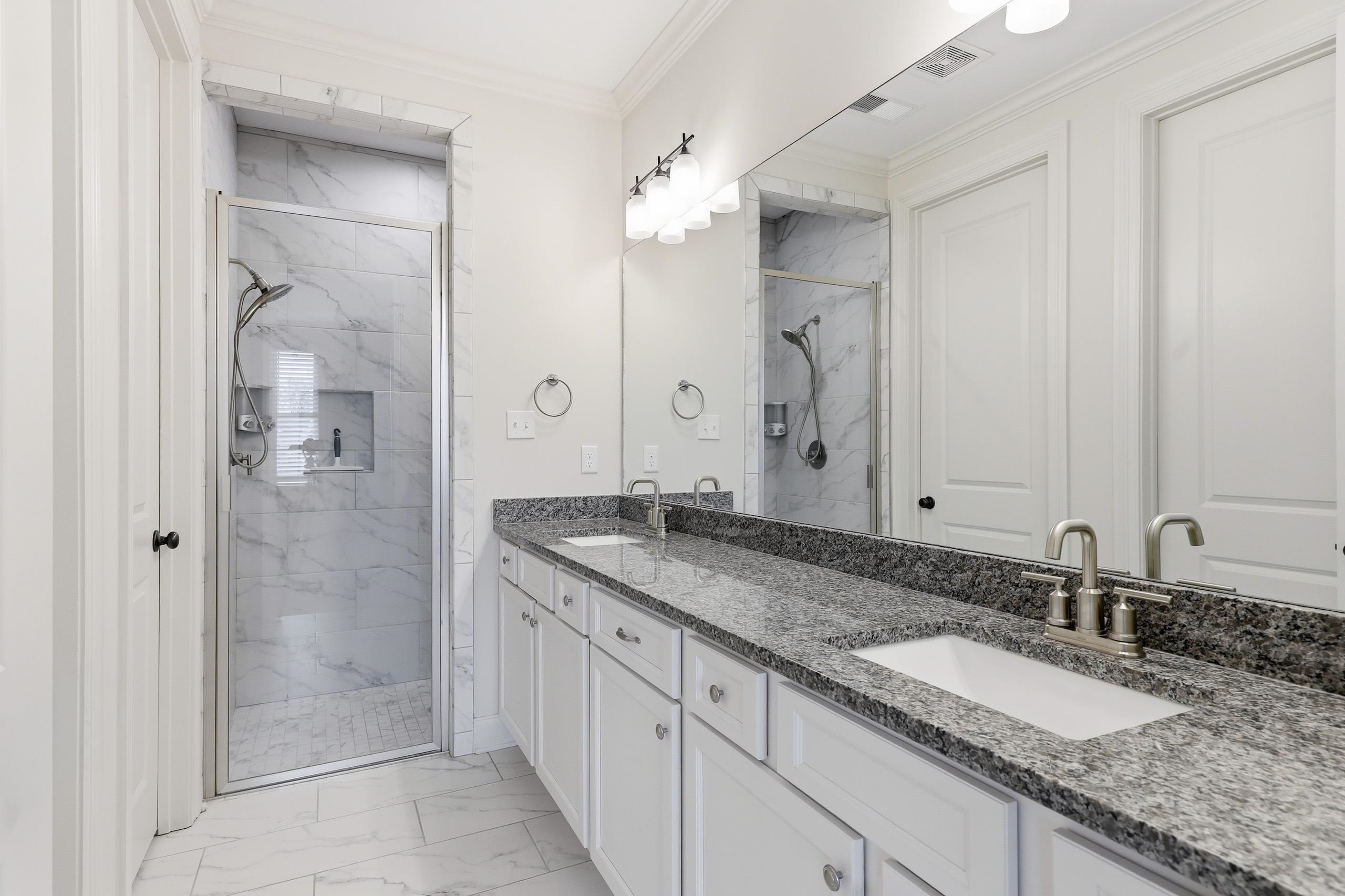 897 Ufton Alley Collierville, TN 38017 - Photo 17 of 32 a bathroom with a granite countertop double vanity sink and a mirror