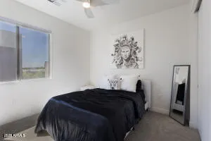 a bedroom with a bed and a walk in closet