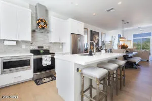 a kitchen with refrigerator and cabinets