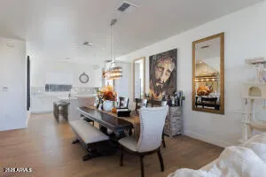 a dining room with furniture and window