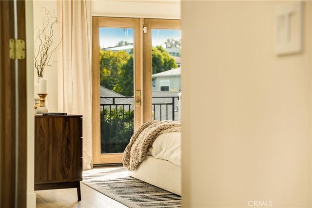 a bedroom with a bed and a mirror