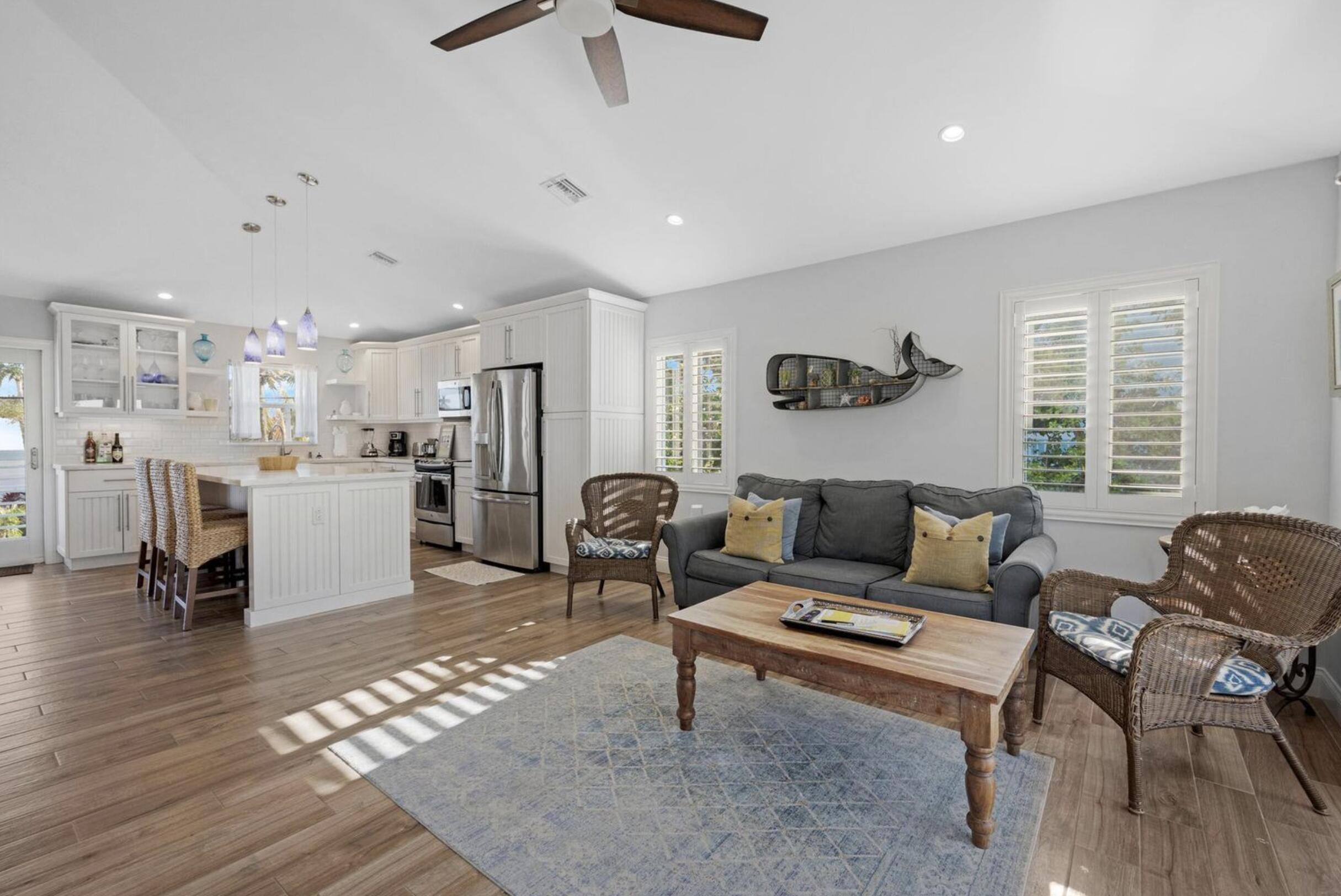 102 Venetian Drive Islamorada, FL 33036 - Photo 11 of 29 a living room with furniture and a table