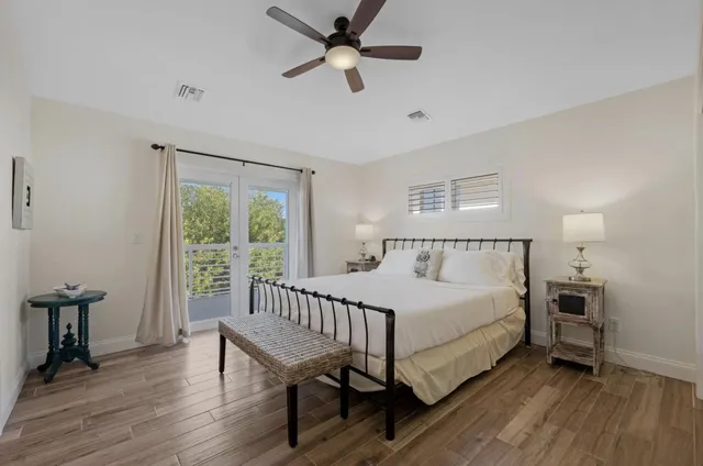 a bedroom with a bed and window