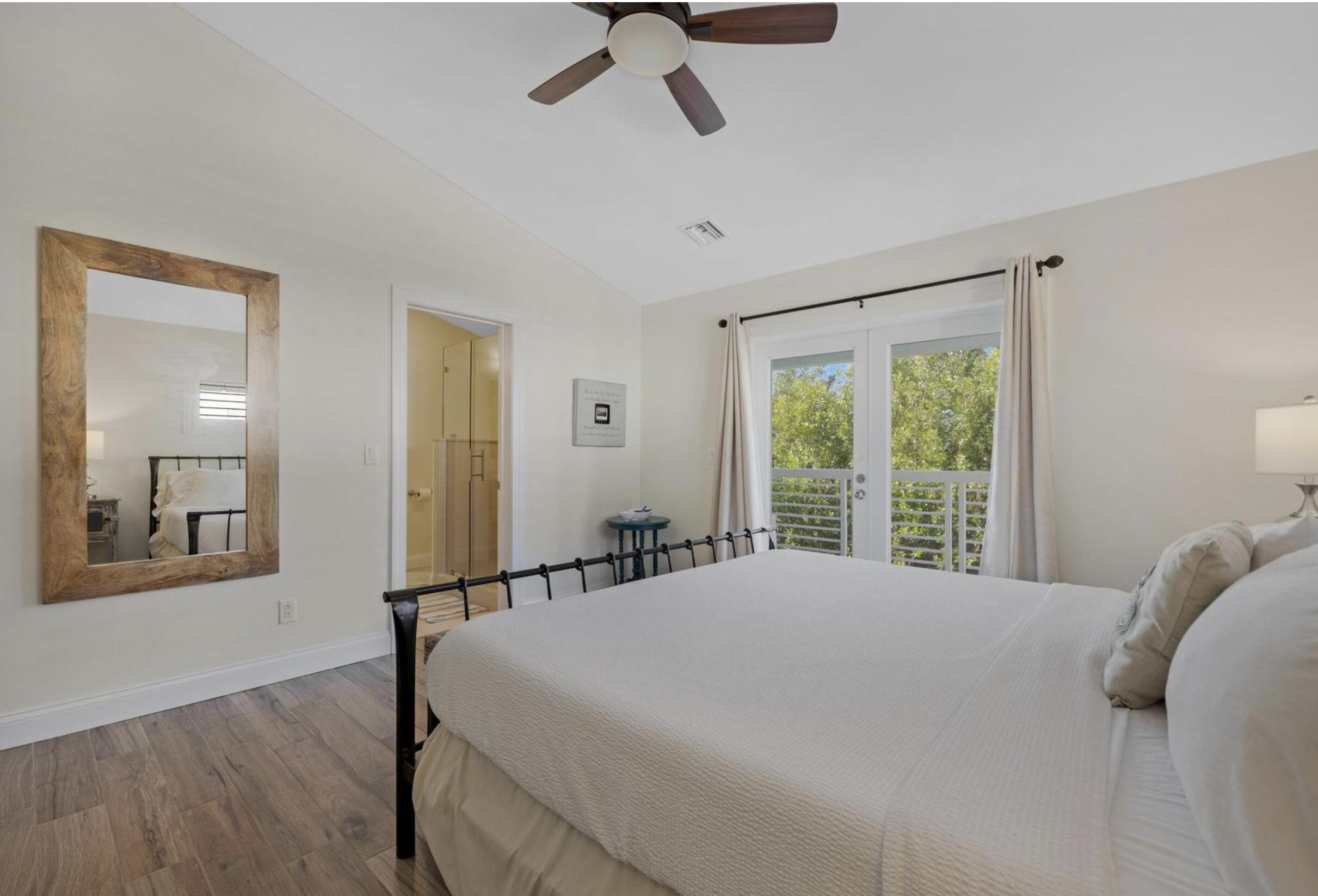 102 Venetian Drive Islamorada, FL 33036 - Photo 15 of 29 a bedroom with a bed and window