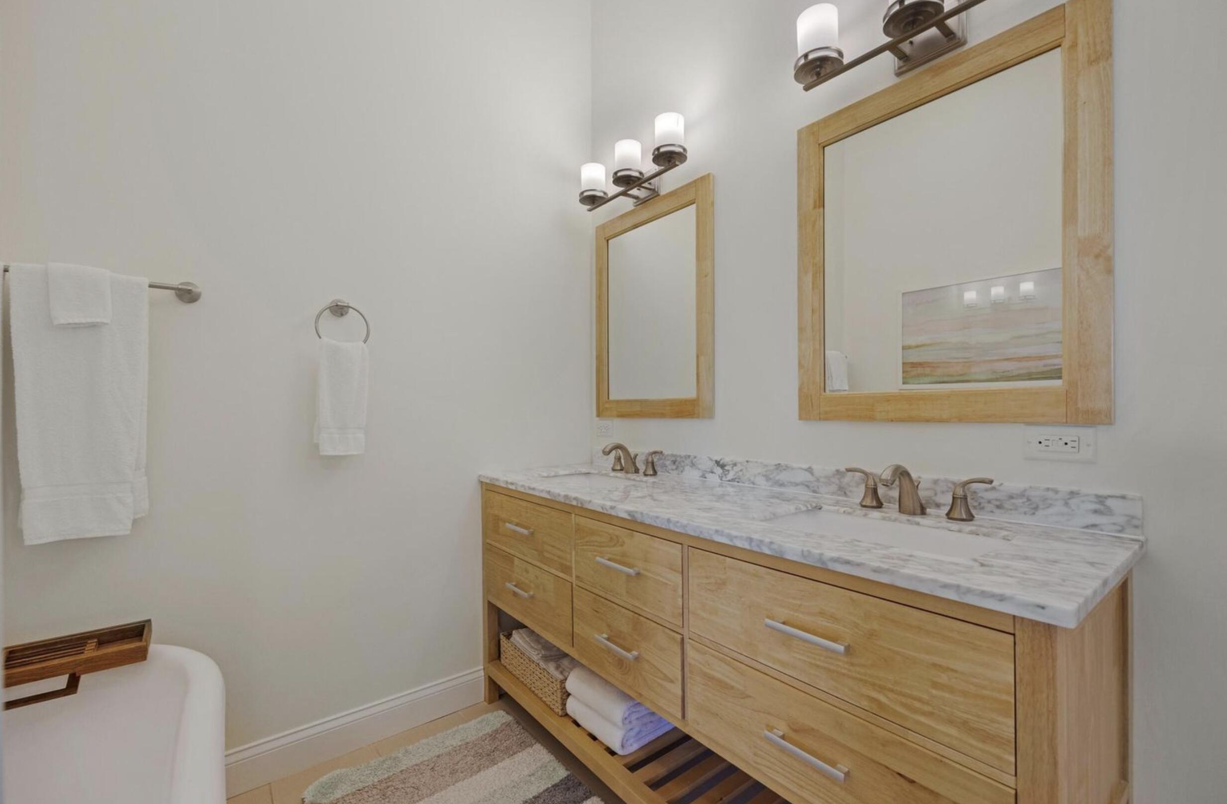 102 Venetian Drive Islamorada, FL 33036 - Photo 16 of 29 a bathroom with a double vanity sink and a mirror