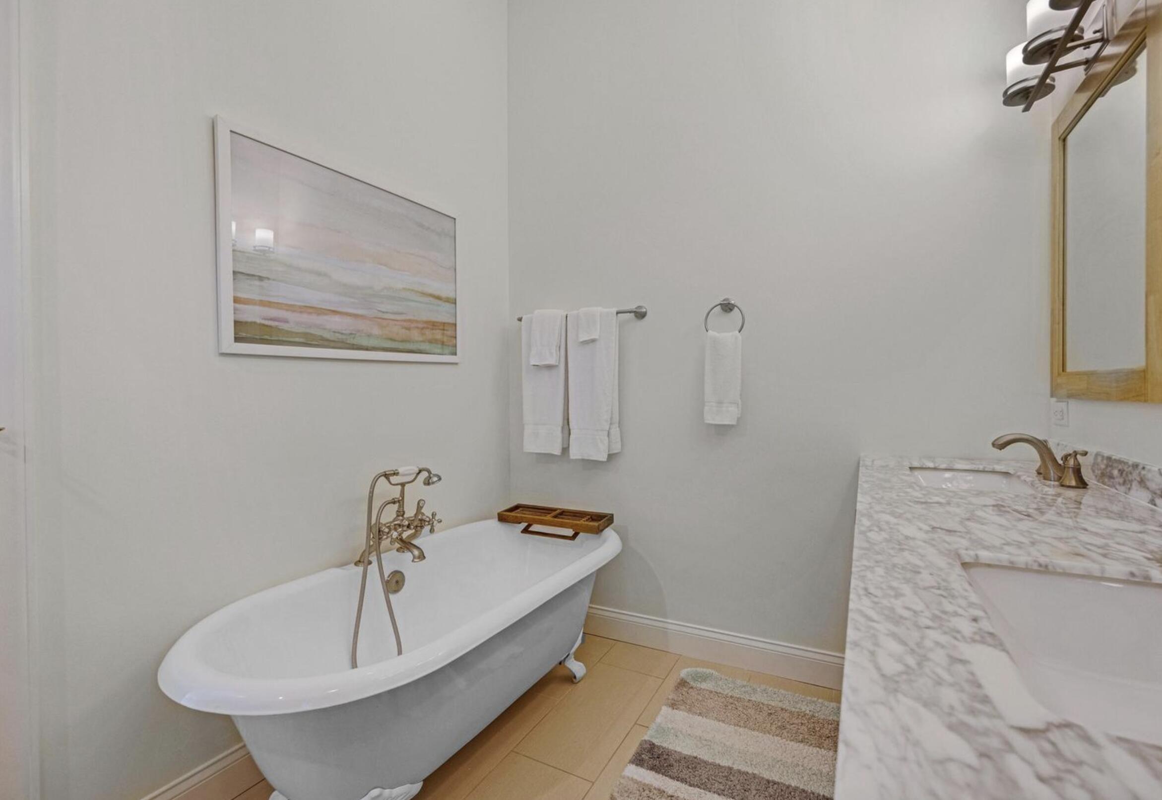 102 Venetian Drive Islamorada, FL 33036 - Photo 17 of 29 a bathroom with a tub sink and mirror