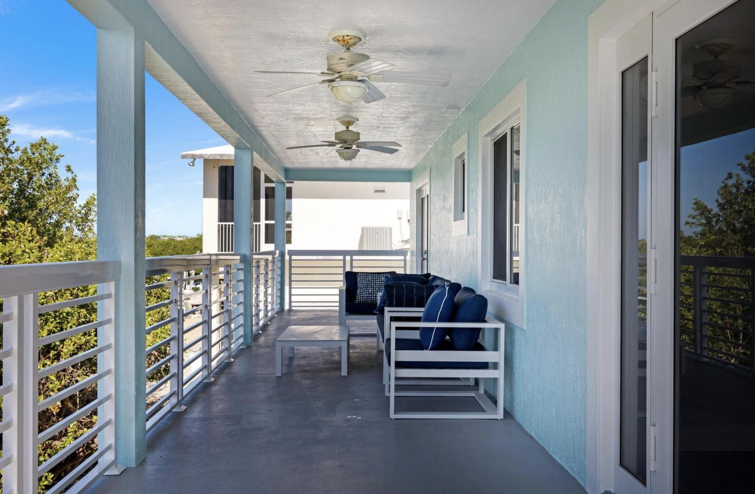 102 Venetian Drive Islamorada, FL 33036 - Photo 21 of 29 a view of entryway with stairs and furniture