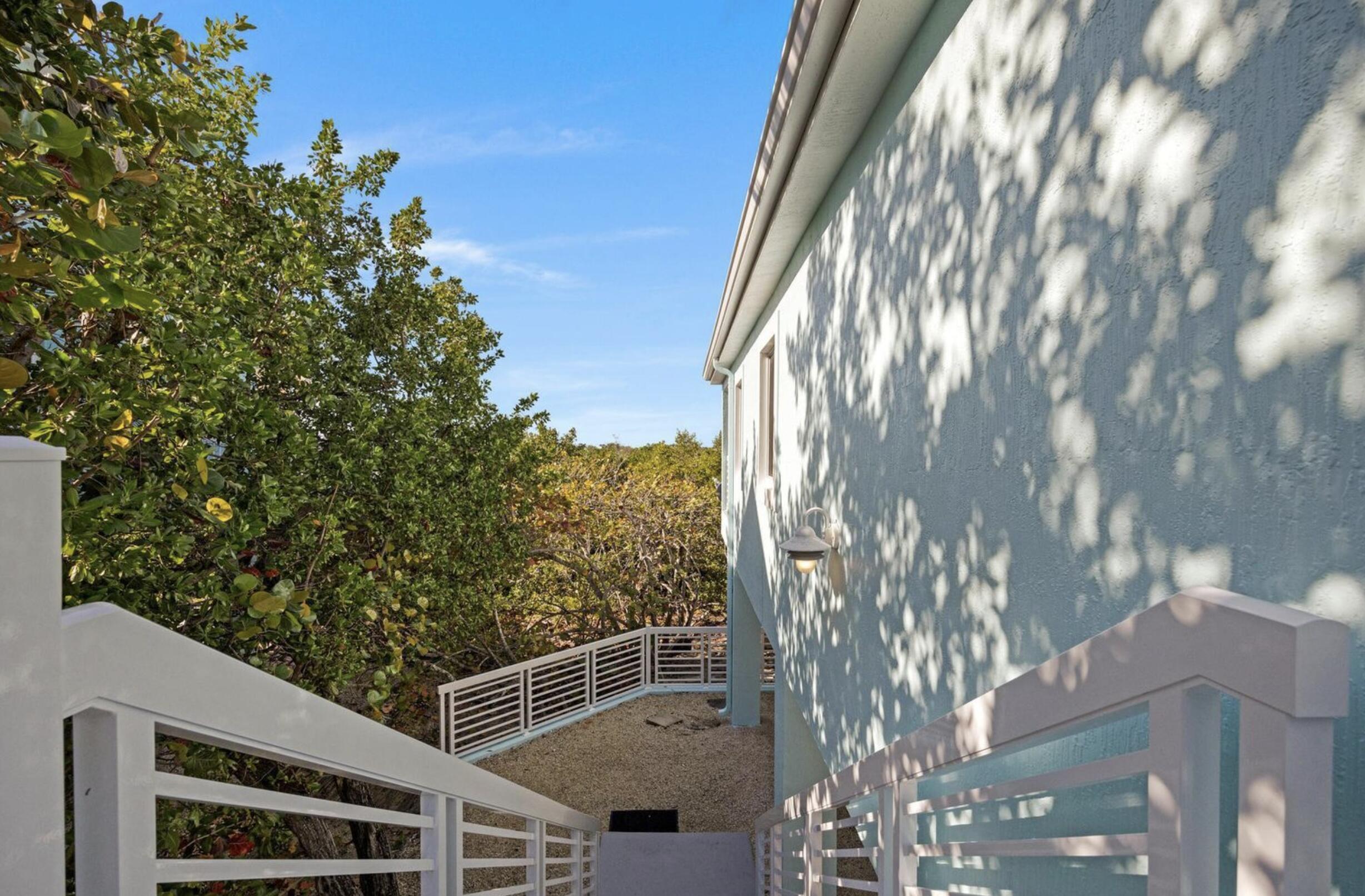 102 Venetian Drive Islamorada, FL 33036 - Photo 23 of 29 a view of a house with a tree