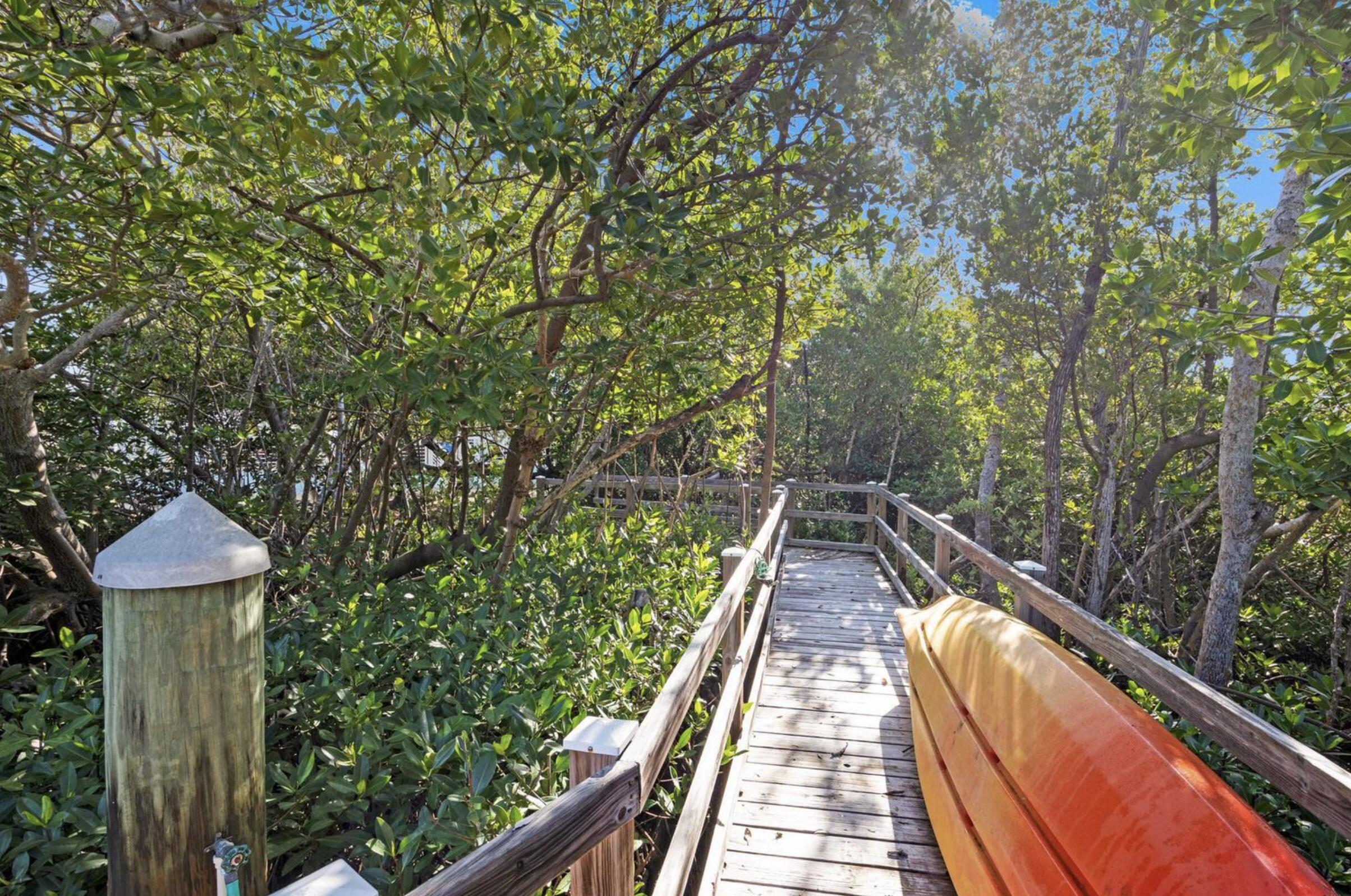 102 Venetian Drive Islamorada, FL 33036 - Photo 27 of 29 a view of balcony with wooden floor and fence