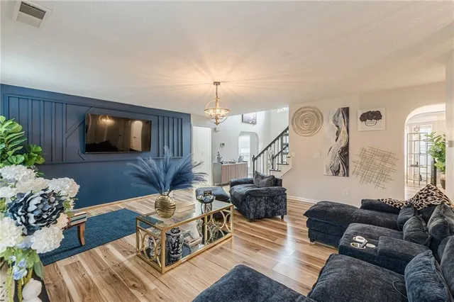 a living room with furniture and a flat screen tv