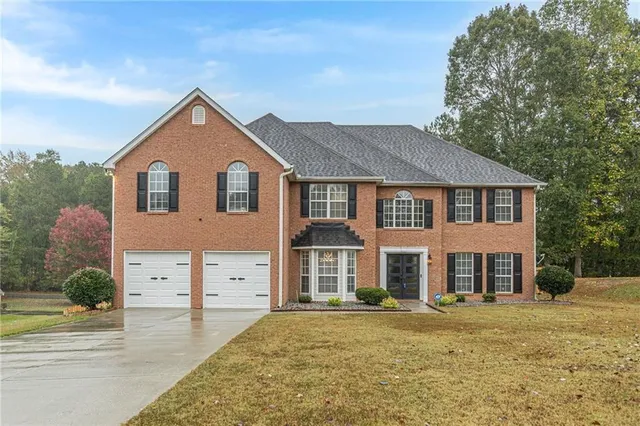front view of a house with a yard