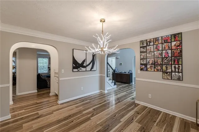 a view of a living room with furniture and a fireplace