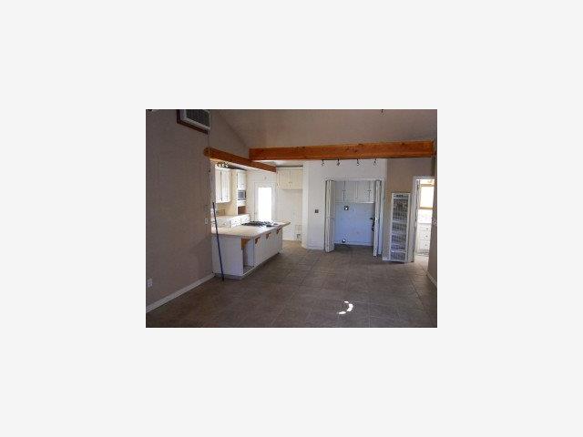 12 Varni Road Watsonville, CA 95076 - Photo 1 of 5 a open living room with a chair and white walls