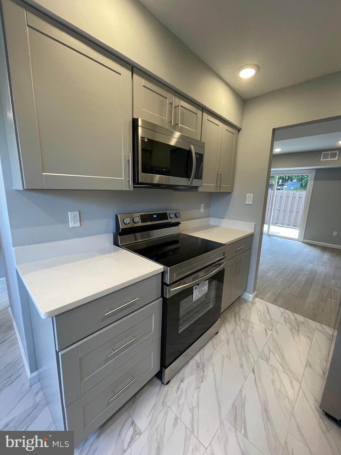 124 Andrew Place Sterling, VA 20164 - Photo 11 of 70 a kitchen with a sink and a microwave