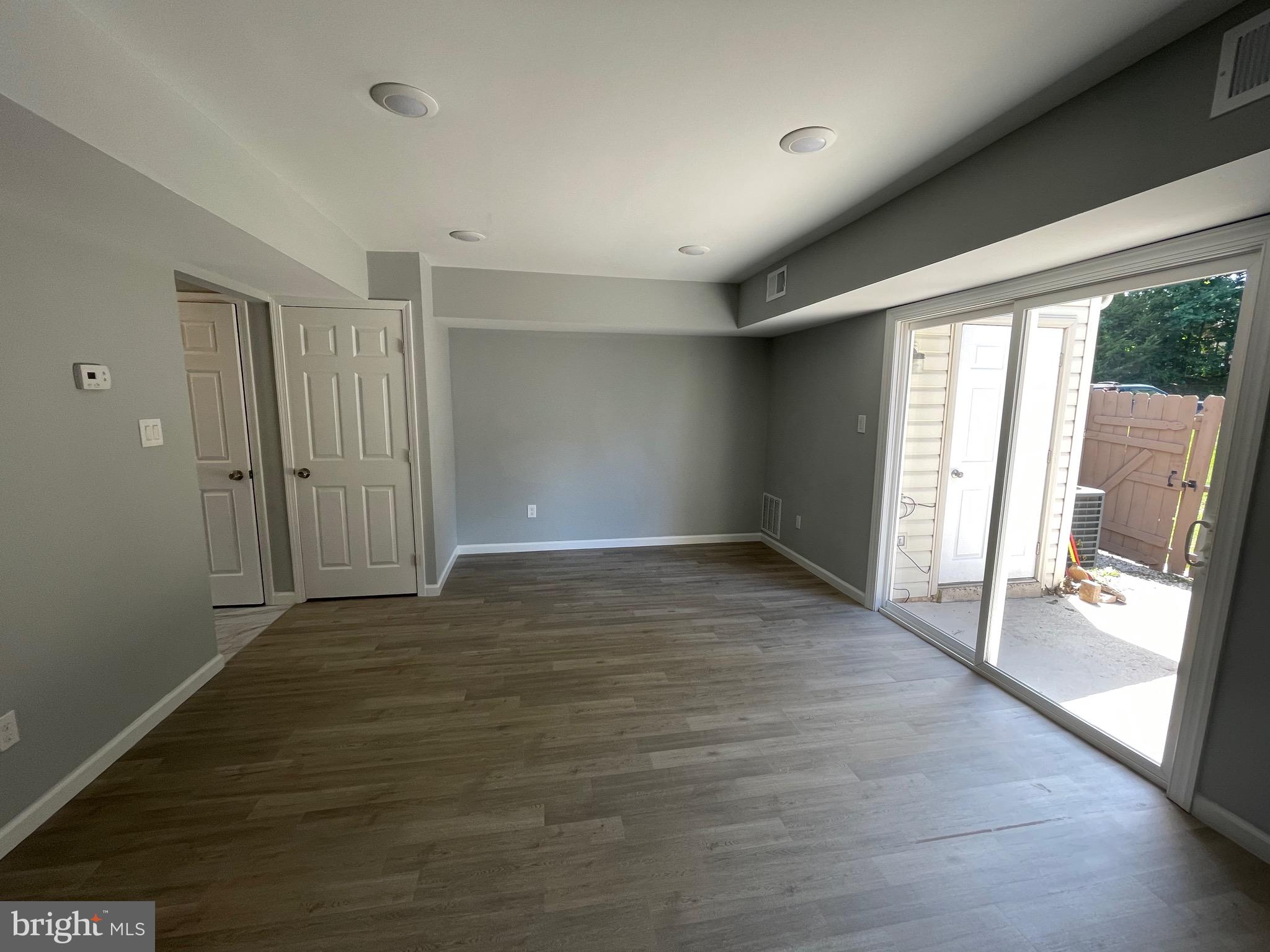 124 Andrew Place Sterling, VA 20164 - Photo 23 of 70 wooden floor in an empty room with a window