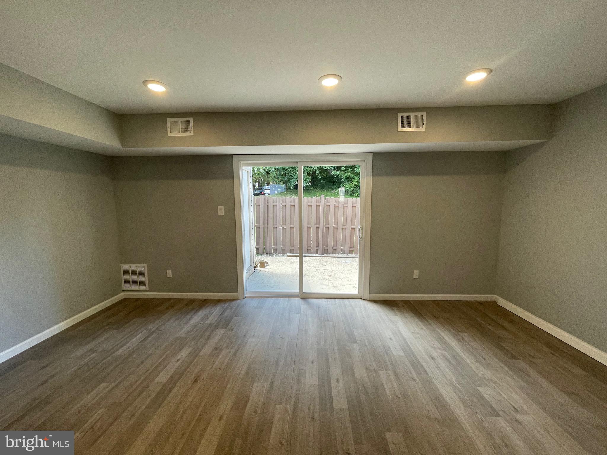 124 Andrew Place Sterling, VA 20164 - Photo 25 of 70 an empty room with wooden floor and a window