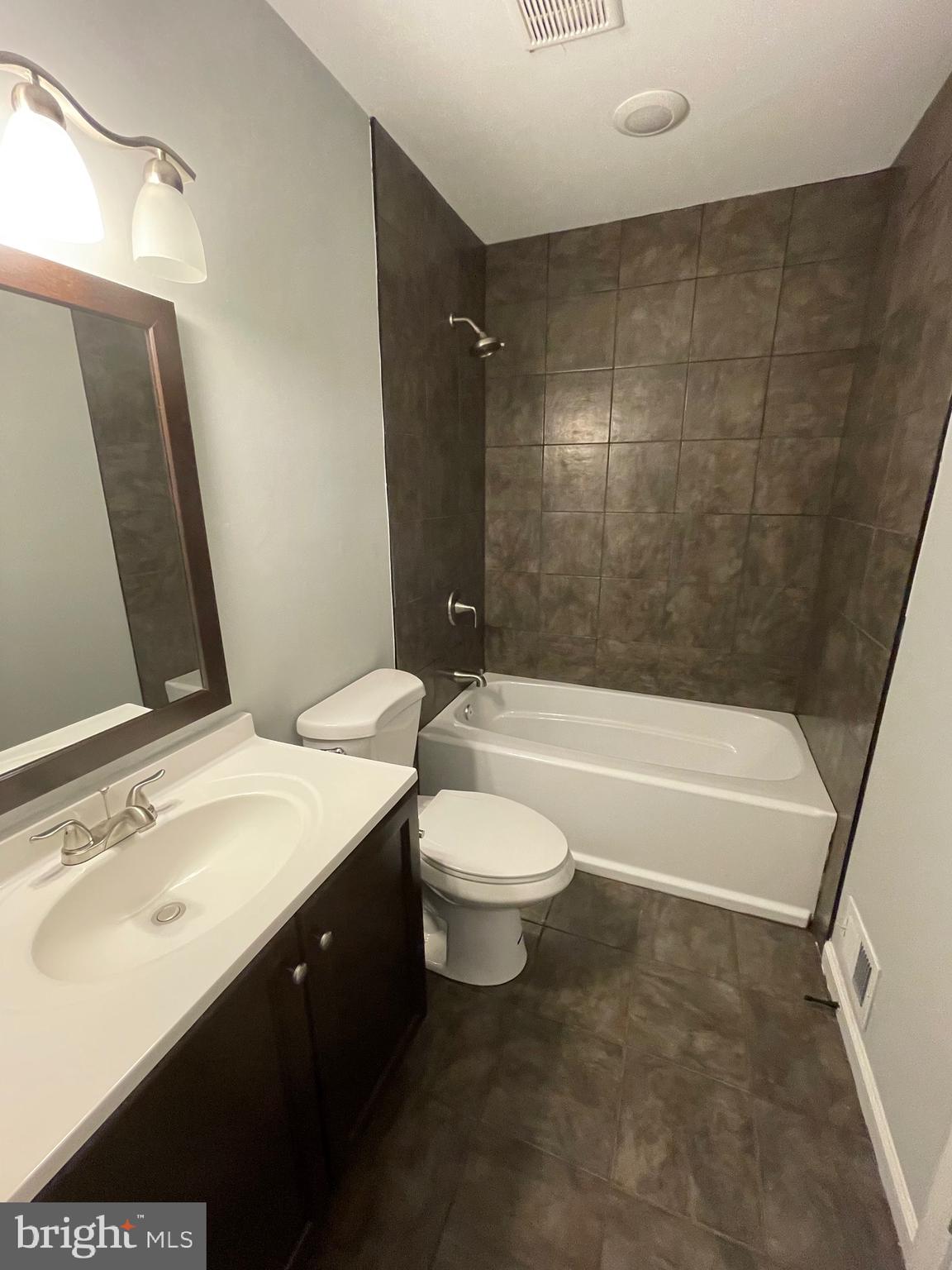 124 Andrew Place Sterling, VA 20164 - Photo 27 of 70 a bathroom with a sink a toilet and shower