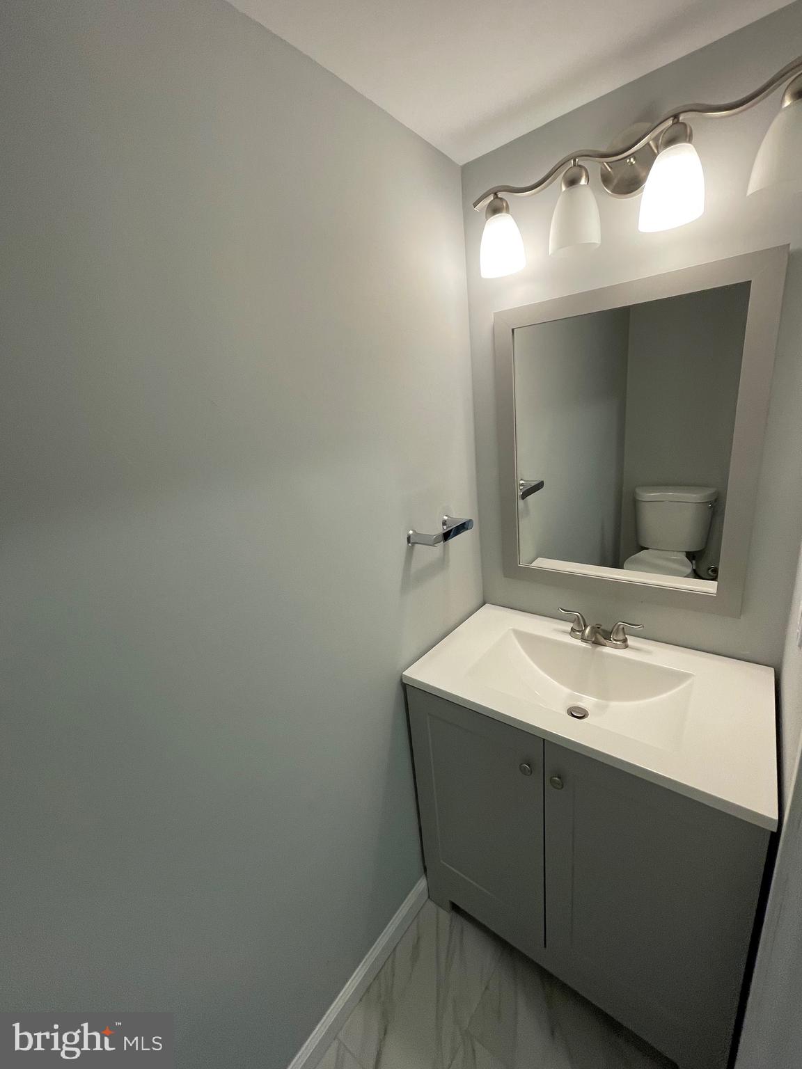124 Andrew Place Sterling, VA 20164 - Photo 38 of 70 a bathroom with a sink and a mirror